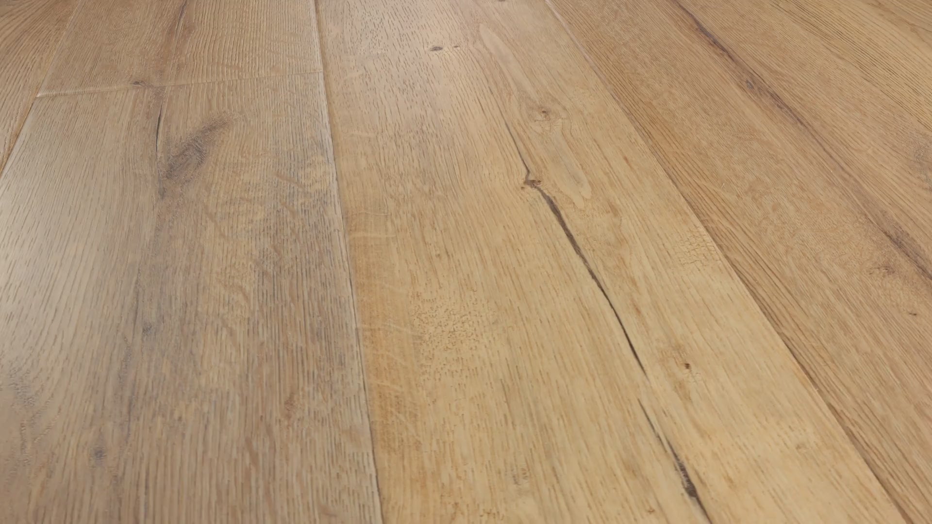 Close-up camera pans across installed COREtec Sand luxury vinyl plank flooring, highlighting its warm sandy oak tones, detailed wood grain, knots and natural plank variation.
