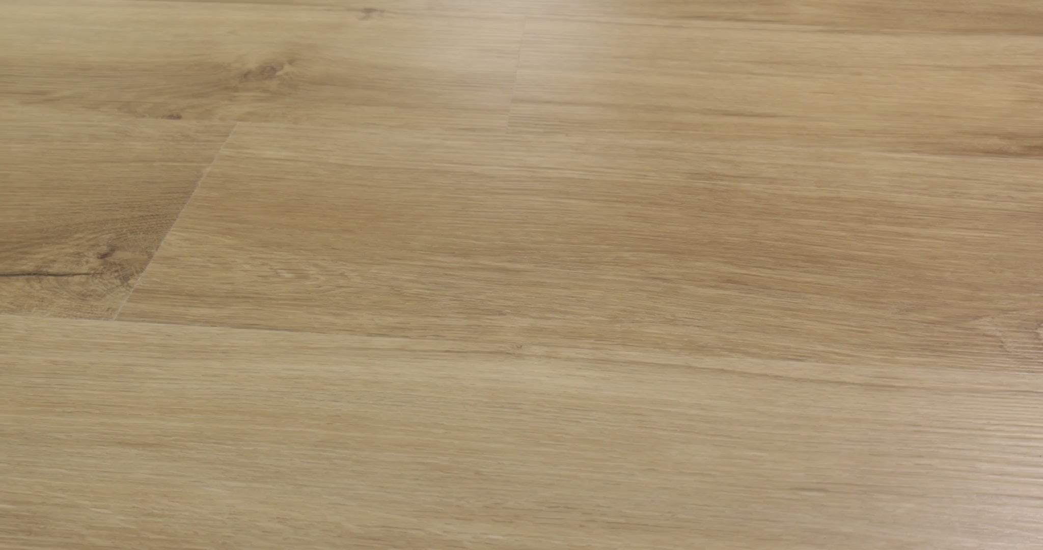 Flowing wood-look grain and scattered dark knots cross the sandy tan planks of Shaw Endura Plus Marina. Embossing and micro-beveled edges define its 7-inch-wide, 48-inch-long format. The 4.8 mm SPC plank includes an attached EVA pad for underfoot comfort. Its warm neutral appearance can complement coastal and transitional interiors.