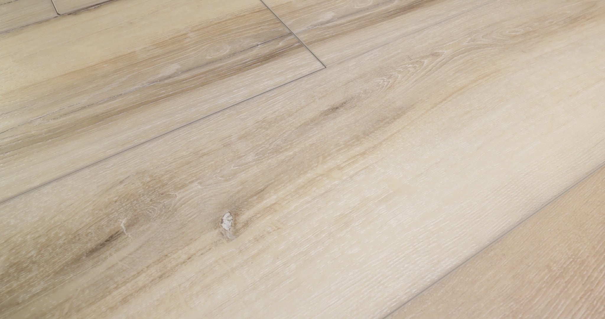Close-up of installed COREtec Ezra Oak WPC Vinyl Plank Flooring VV457-02909 LVP Originals Premium 9" x 72", showing detailed wood grain and wide-plank seams.