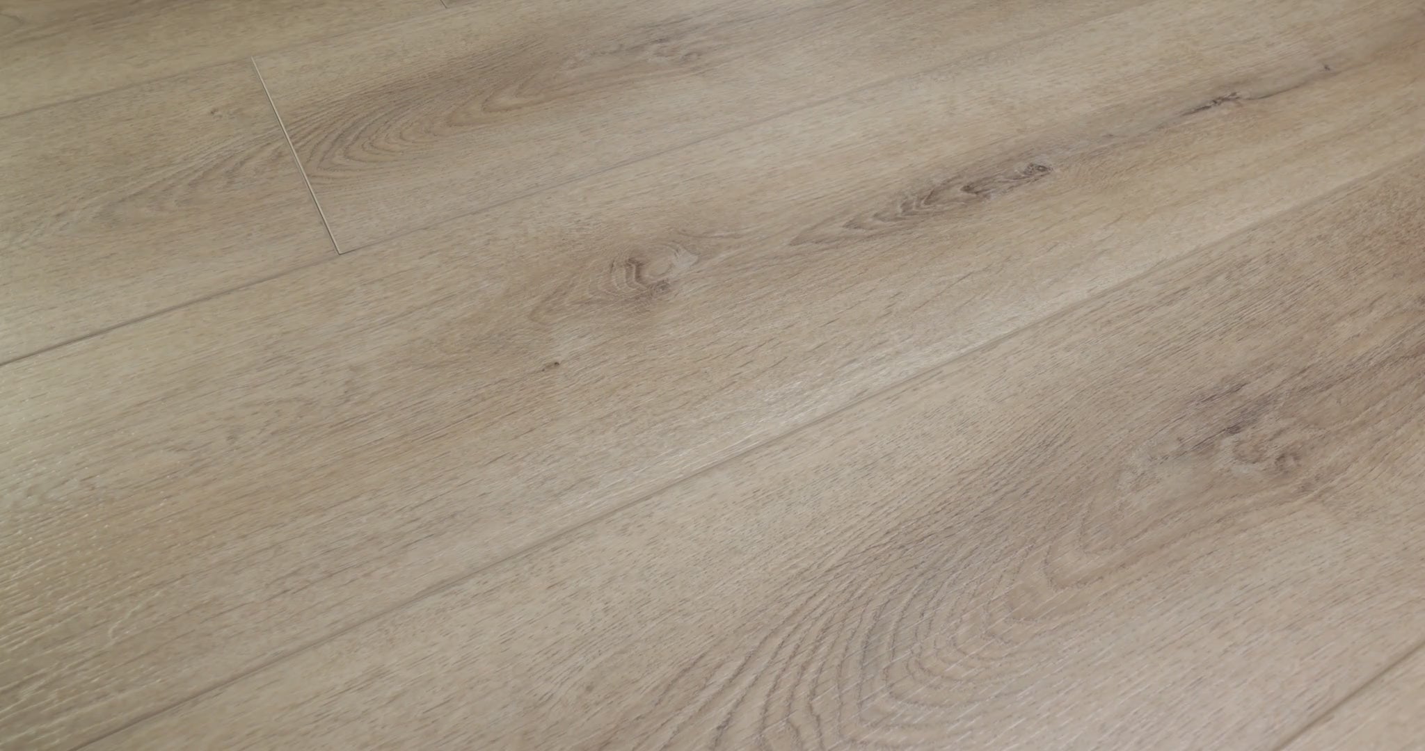 Oak-style curves offer a softer pattern than pronounced pine-like stripes in Shaw Paladin Plus Toasted Taupe (0278V-05218). The taupe-brown vinyl has small knots, painted bevels and Shaw's ScufResist finish. Scandinavian-style and contemporary interiors are suggested by the product's furnished scenes. Talk through Toasted Taupe's video with Floor City before deciding.