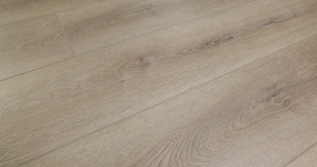 Oak-style curves offer a softer pattern than pronounced pine-like stripes in Shaw Paladin Plus Toasted Taupe (0278V-05218). The taupe-brown vinyl has small knots, painted bevels and Shaw's ScufResist finish. Scandinavian-style and contemporary interiors are suggested by the product's furnished scenes. Talk through Toasted Taupe's video with Floor City before deciding.