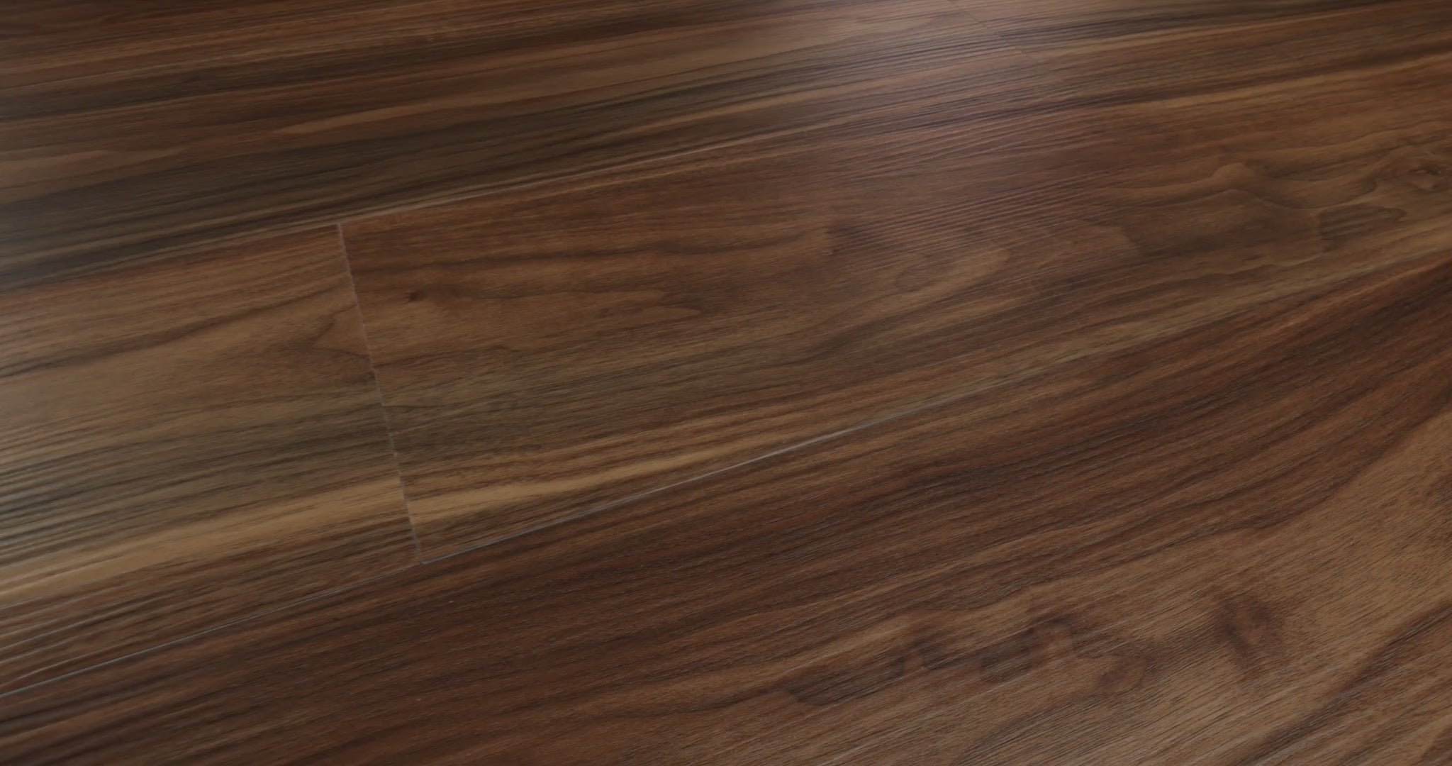 Long, flowing wood-pattern ribbons alternate between warm brown and deeper shades of Modern Classic 0736V-07295 on Endura Plus series of Shaw Floors. Micro-beveled 7-by-48-inch vinyl planks have 4.8 mm SPC construction and are specified for floating installation. Its rich visual movement provides a possible foundation for contemporary or midcentury modern interiors.