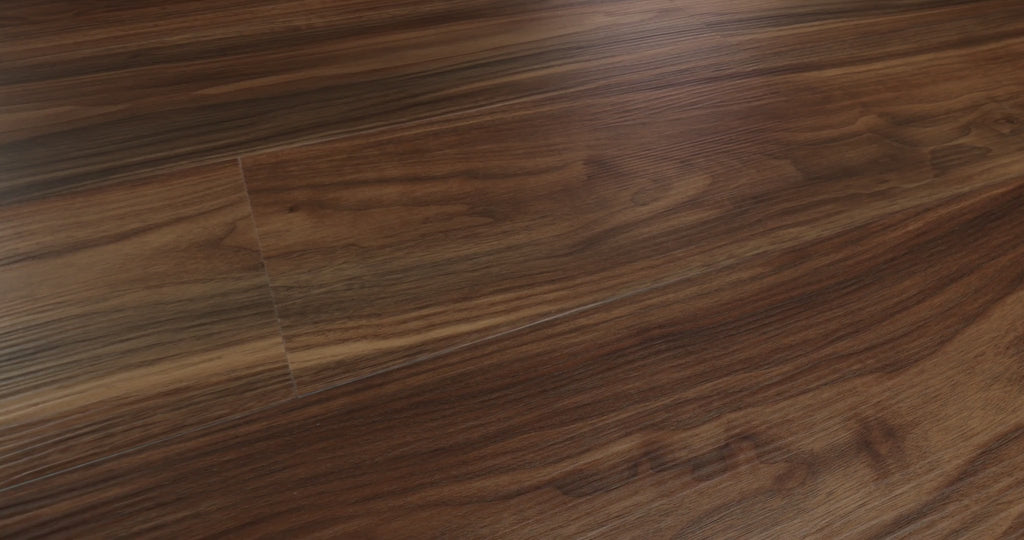 Long, flowing wood-pattern ribbons alternate between warm brown and deeper shades of Modern Classic 0736V-07295 on Endura Plus series of Shaw Floors. Micro-beveled 7-by-48-inch vinyl planks have 4.8 mm SPC construction and are specified for floating installation. Its rich visual movement provides a possible foundation for contemporary or midcentury modern interiors.