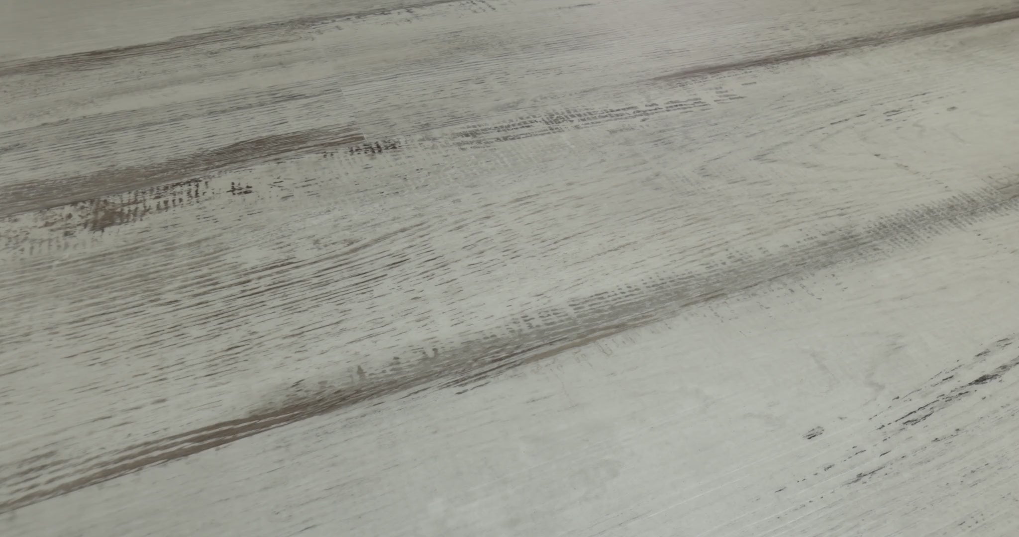 Compared with darker weathered wood looks, Shaw Endura Plus Fresh Driftwood appears pale gray with sharply contrasting brown-gray streaks. Its embossed, distressed-looking vinyl design comes in 7-inch-wide, 48-inch-long SPC planks with 4.8 mm thickness and attached EVA padding. Its pale, weathered appearance can support coastal cottage and modern farmhouse styling.
