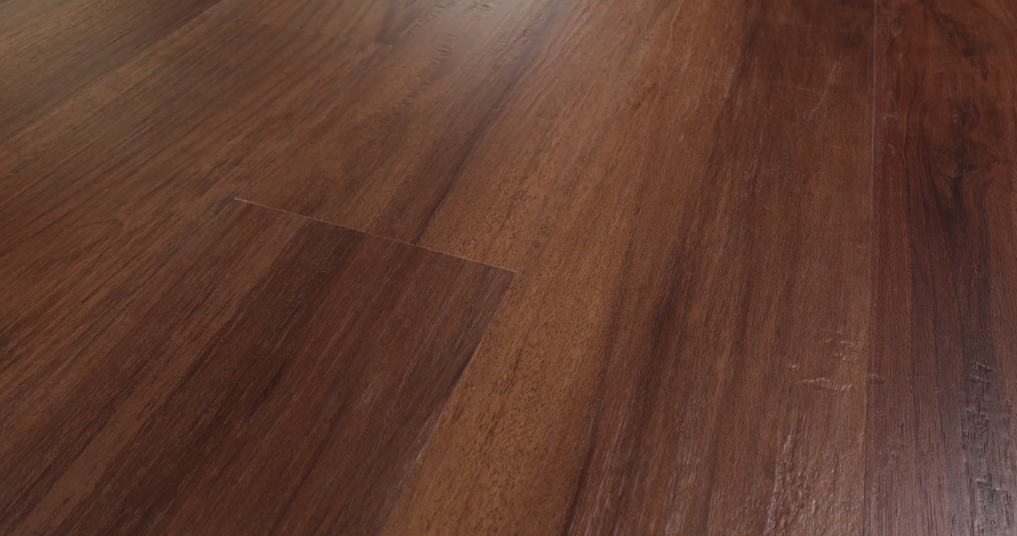 Traditional and Craftsman-style interiors can draw warmth from the amber and reddish-brown oak look of Shaw Endura 512C Plus Amber Oak 0736V-00820. Darker grain runs through its embossed vinyl surface. Each 7-by-48-inch SPC plank is 4.8 mm thick and comes with EVA padding for added comfort underfoot.