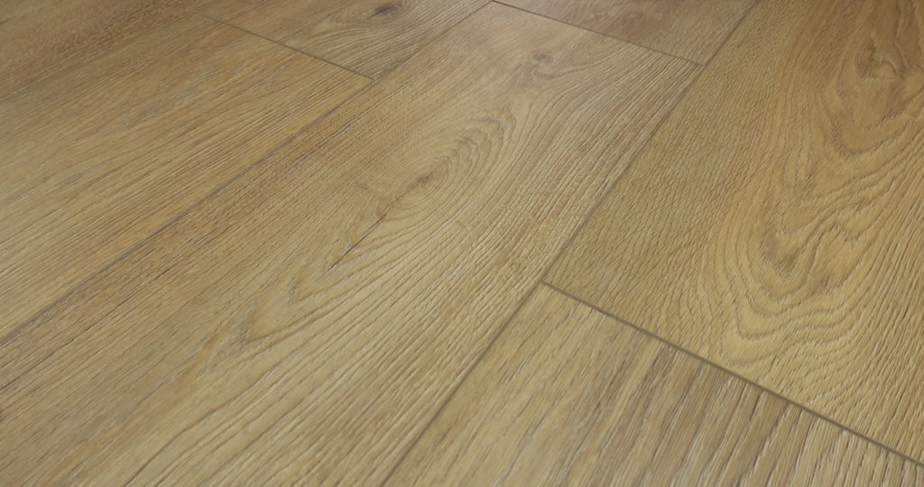 Cabriole Brown wood-look vinyl flooring from Shaw Fresh Take in moving close views, showing warm brown planks, broad grain curves, dark knots and visible joints.
