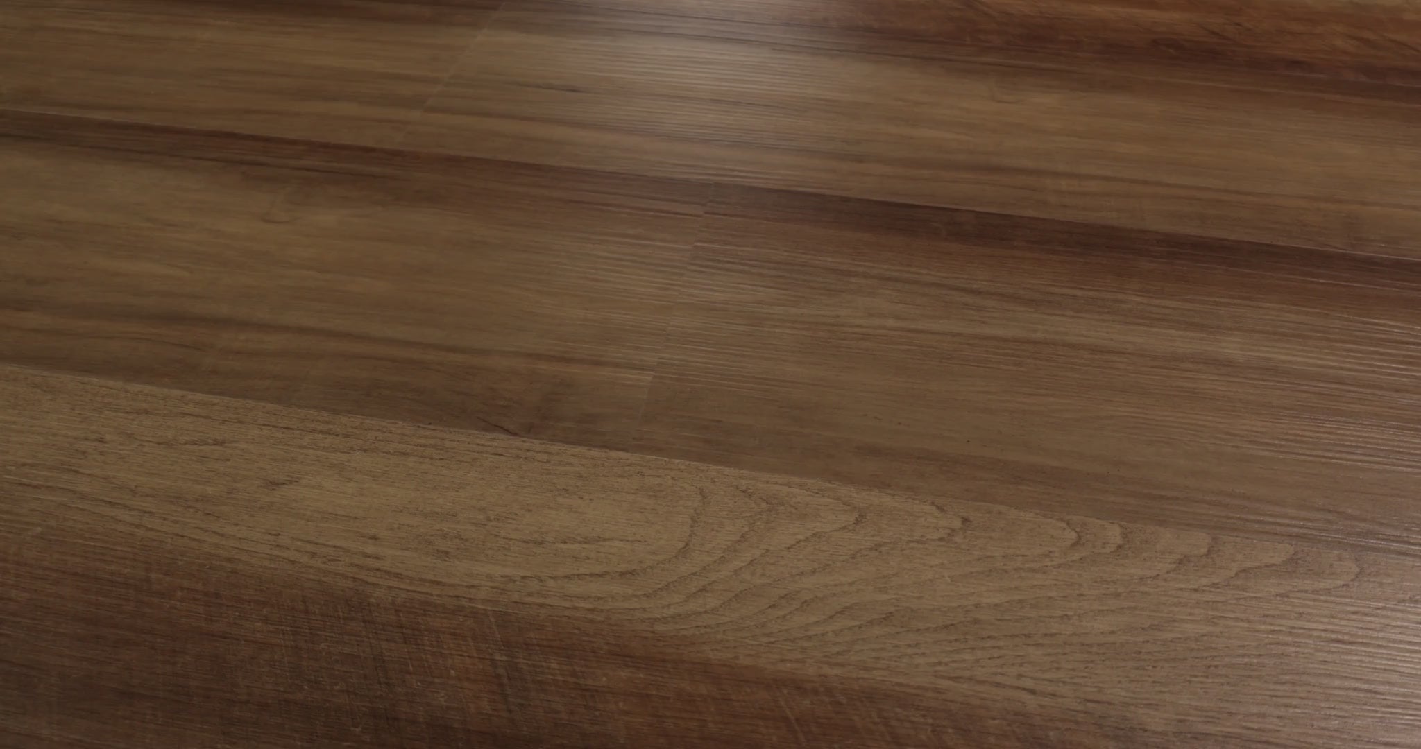 Textured oak-look grain follows golden brown areas and deeper brown streaks across Tawny Oak Shaw Endura 512C Plus. Attached EVA backing adds cushioning to its 4.8 mm SPC construction, supplied in 7-by-48-inch vinyl planks with small edge bevels. The varied warm coloring suits the visual character of Craftsman and traditional, rustic, or farmhouse interiors.