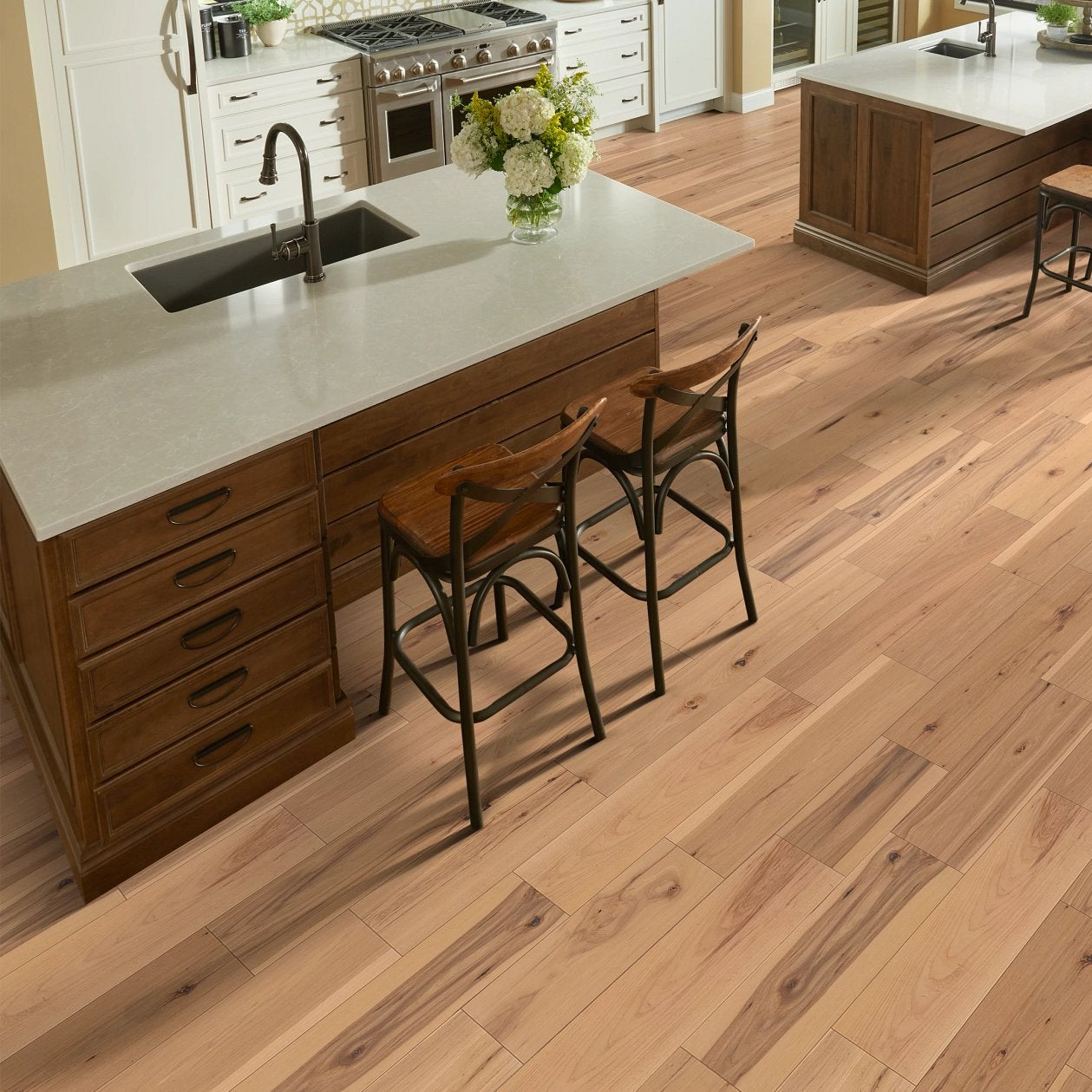 Living room view of Shaw Landmark Sliced Hickory Acadia engineered hardwood flooring, showing natural wood hardwood color near sofa seating and the open floor area.