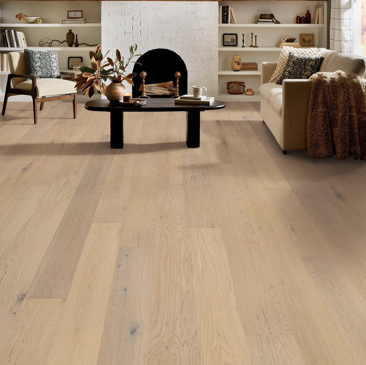 Shaw Cornerstone II Mist engineered hardwood flooring photographed in a living room, pairing soft neutral hardwood with the furniture layout.